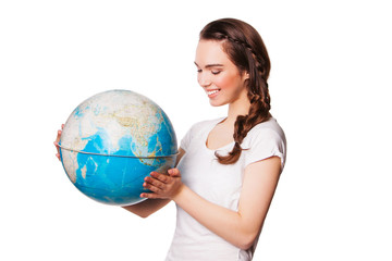 pretty smiling young lady holding a world globe. isolated on