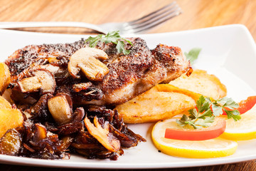 Fried pork chop with mushrooms and chips