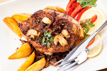 Fried pork chop with mushrooms and chips