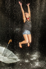 Woman with umbrella. Water studio photo