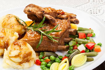 Pork spareribs served with mashed potatoes