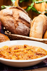 Beans with tomato sauce, bacon and sausage
