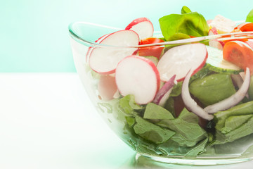 Fresh vegetable salad with cucumber and radish