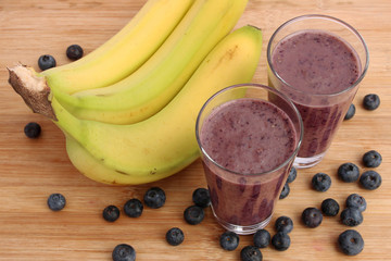Blueberry smoothie made with banana and ground flax seeds - 64506494