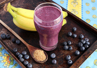 Blueberry smoothie made with banana and ground flax seeds - 64506498