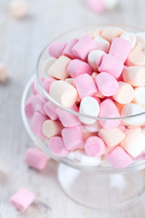 marshmallows in beautiful glass dish on a wooden table