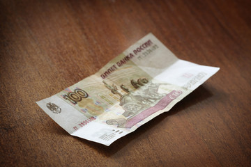 Russian banknote on a wooden table