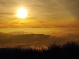 Autumn sunrise above forest hills