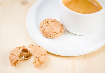 top of view of cup of italian espresso coffee near biscuit