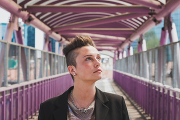 Pretty short hair girl posing on a bridge