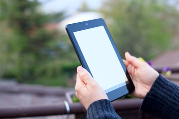 person holding tablet