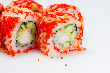 Sushi roll with red tobiko. Macro.