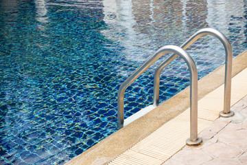 Obraz premium blue swimming pool with stair at sport center