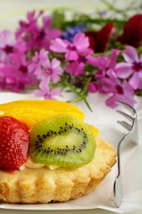 piece of cake with strawberry on a fork