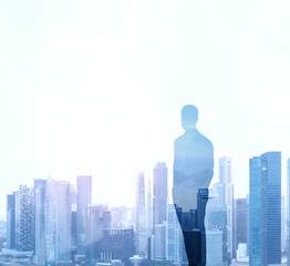 double exposure of businessman and city