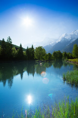 Lake reflections in sunshine near Chamonix