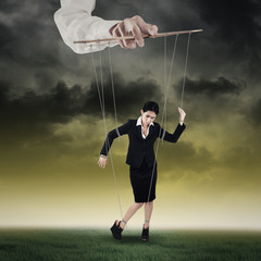 Businesswoman hanging on string 1