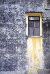 old wooden window and old concrete wall in thailand