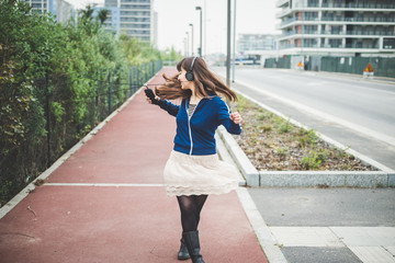 beautiful woman dancing in a desolate landscape