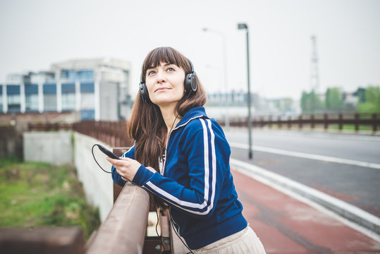 beautiful woman using smart phone and listening music