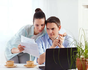 Portrait of happy couple online banking