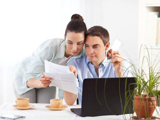 Portrait of happy couple online shopping