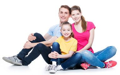 Happy young family with kid sitting.