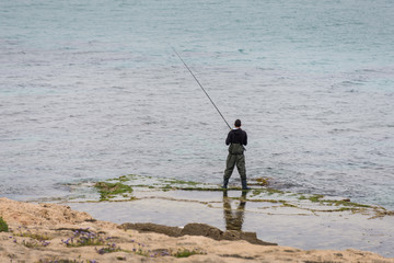 Fisherman at Rosh HaNikra grottoes