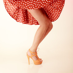 Pinup style. Sexy female legs in dance.