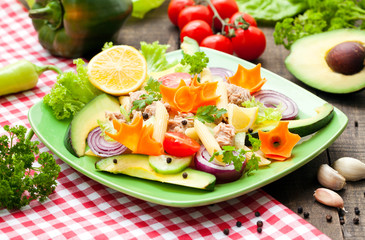 tuna salad with pasta, avocado and vegetables