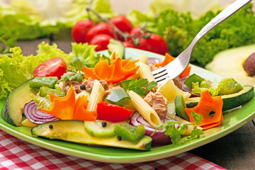 fresh tuna salad with fork in the plate