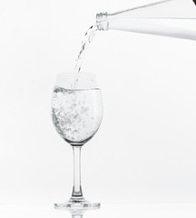 Pouring water on glass