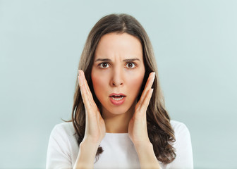 Studio portrait of a young stressed woman