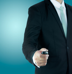 Fototapeta premium Businessman standing posture hand key for car isolated