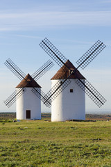 Fototapeta na wymiar Two windmills front view