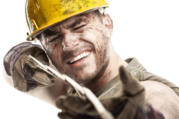 portrait of dirty worker with helmet measuring with classic wood