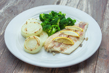Steamed snapper with broccoli and grilled onions