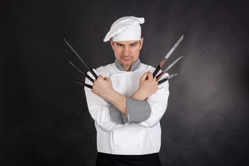 Chef with knifes arms crossed
