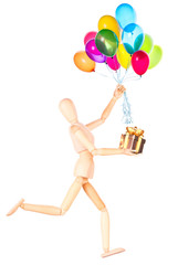 wooden Dummy holding gift and flying balloons