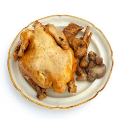 Steamed, spiced whole chicken and its innards.