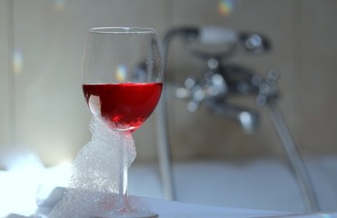 Luxury bath with a glass of wine
