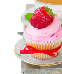 cupcake with strawberry on white