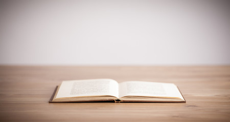 Open book on wooden deck