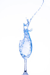 Water splashing in a glass, isolated on white