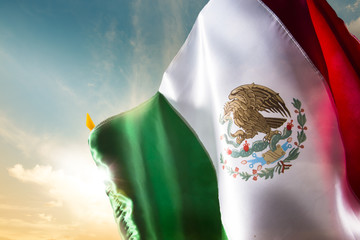 Mexican flag against a bright sky, independence day, cinco de ma