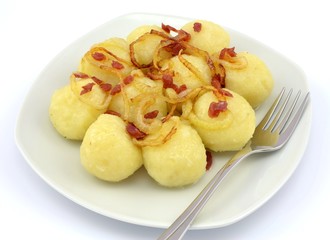 Naklejka na ściany i meble potato dumplings with onion and sausage