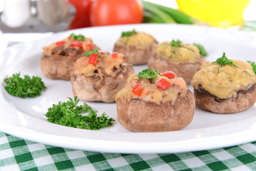 Stuffed mushrooms on plate on table close-up