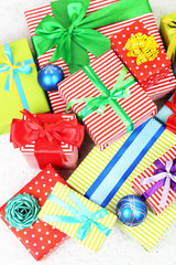 Fototapeta na wymiar Many colorful presents with luxury ribbons