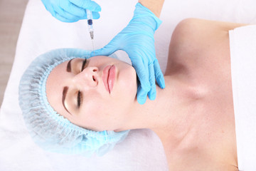 Naklejka premium Woman in beauty clinic getting botox injection,