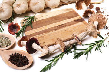 Different spices and cutting board, isolated on white